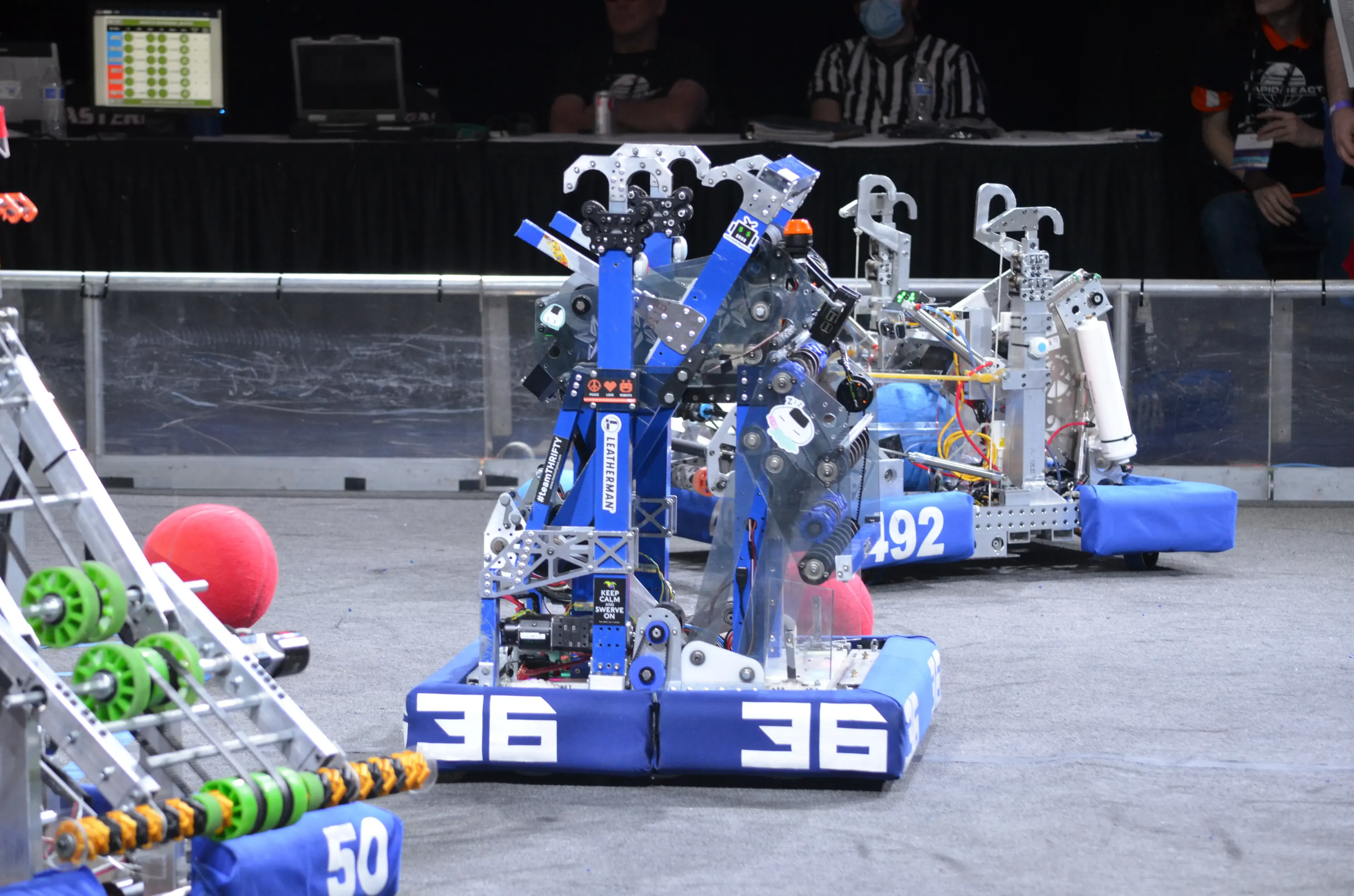 A group of Generals Robotics members working on a robot